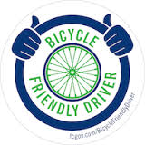 Logo for Fort Collins, CO FC Bikes' Bicycle Friendly Driver Program.. Image of a steering wheel with spoked bicycle wheel as its hub.