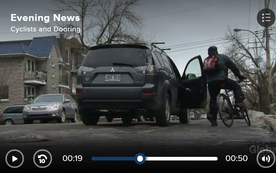 Screen shot from Global News report (2014) on launch of 'One Door One Life' anti dooring campaign by Montreal cycling safety advocates..  Shown is a staging of a doored cyclist standing beisde open obstructive door flung from the left into bike lane. 