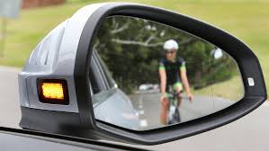 Rear facing radar alerts driver of on-coming cyclists with side mirror flashing LED - Audi A4 2016.