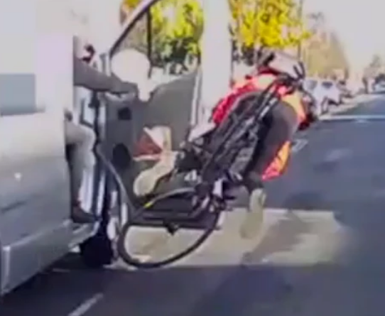 Dash cam still of London cyclist doored & nearlyh run over, seen falling as struck white van door opened into travel lane.